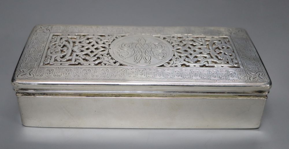A continental white metal mounted rectangular cigarette box, with pierced engraved lid, 18.6cm, gross 17.5oz.